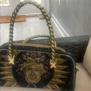 Black and Gold Hobo Bag with Intricate Design